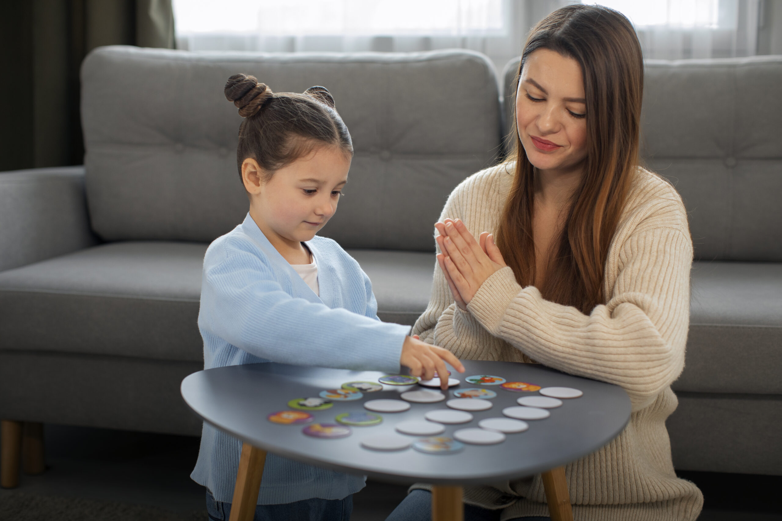 front-view-mother-girl-playing-game (1)
