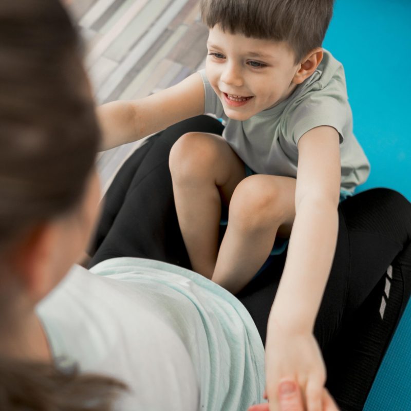 adorable-young-boy-happy-train-with-mother