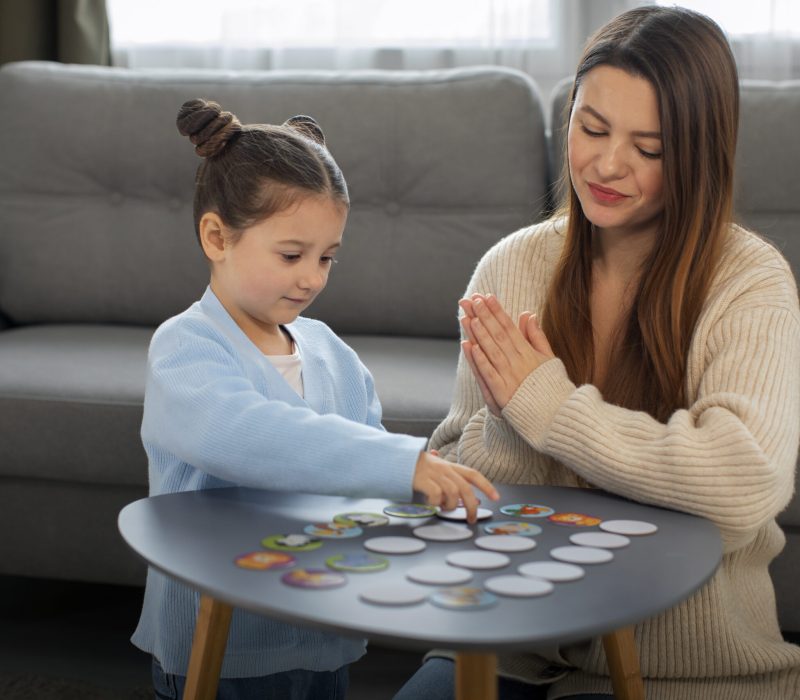 front-view-mother-girl-playing-game (2)